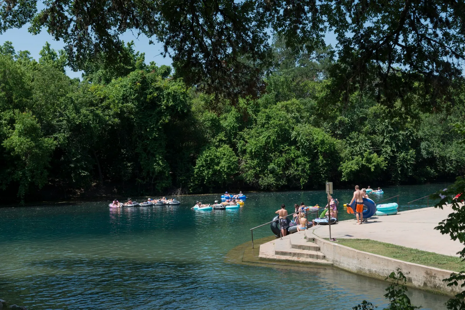 Tubers floating the Comal River in summer